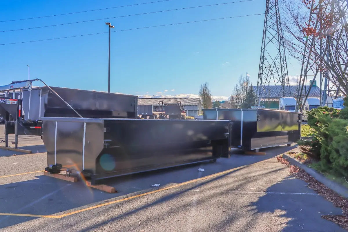Roll-off dumpster ready for waste disposal at job site for 12 Yard Dumpster Rental in East Milton